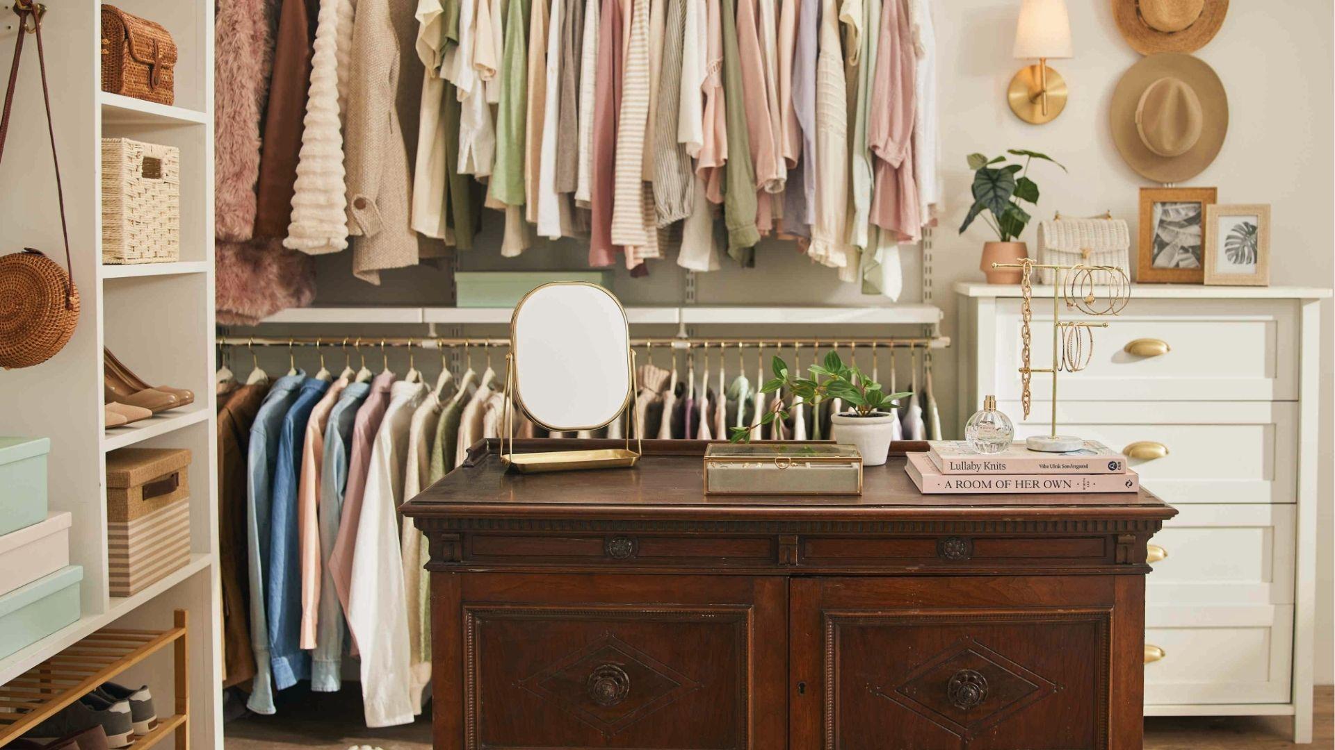Cozy bedroom closet with open shelves, vintage dresser, hat wall display, and hanging garment rods.