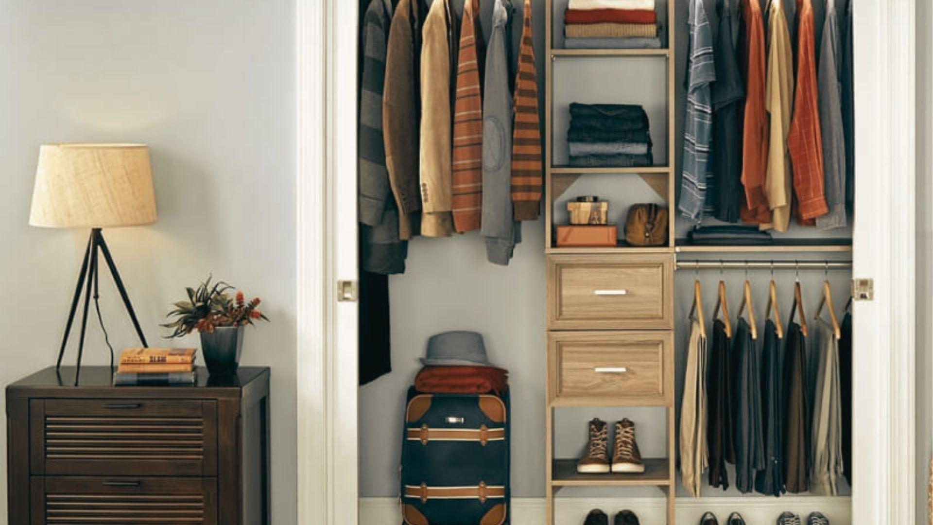 Reach-in closet with mixed shelf depths: shallow 12-inch upper shelves for folded clothes and 24-inch depth for hanging.