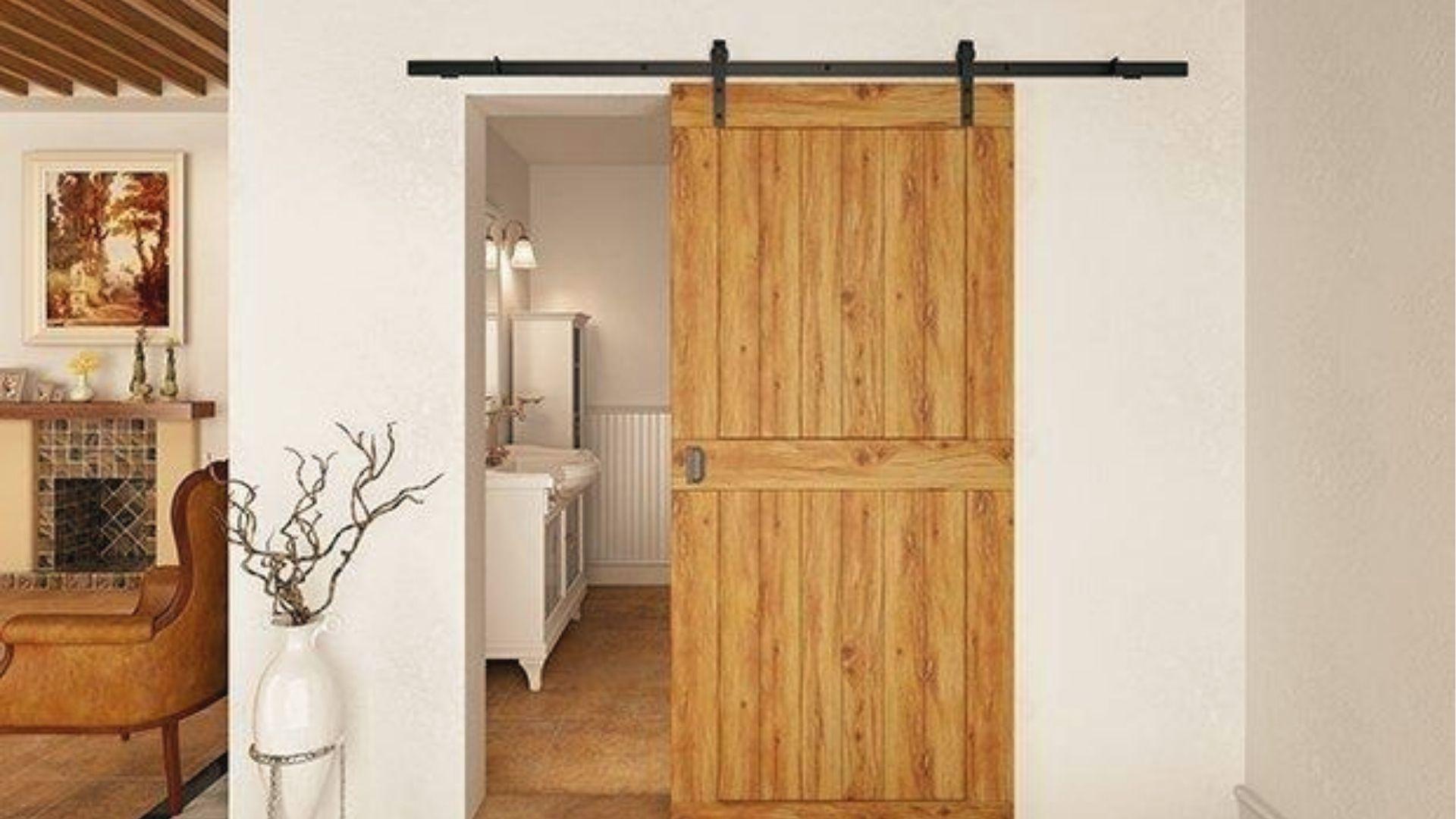 Rustic sliding barn door covers laundry opening, modern alternative to bifold doors.