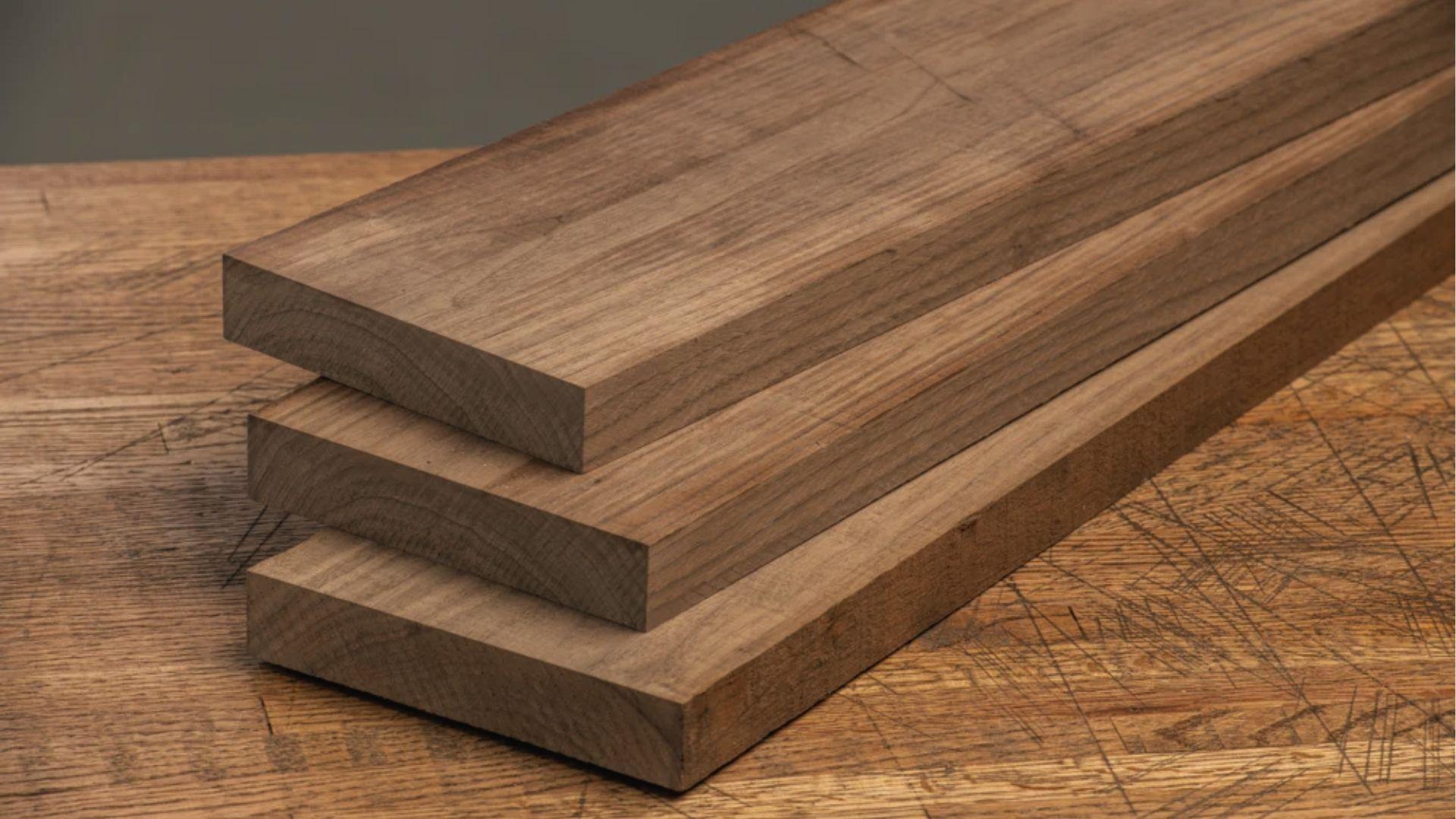 Rich walnut boards showcasing dark tone and hardness, best wood for luxury closet shelves.