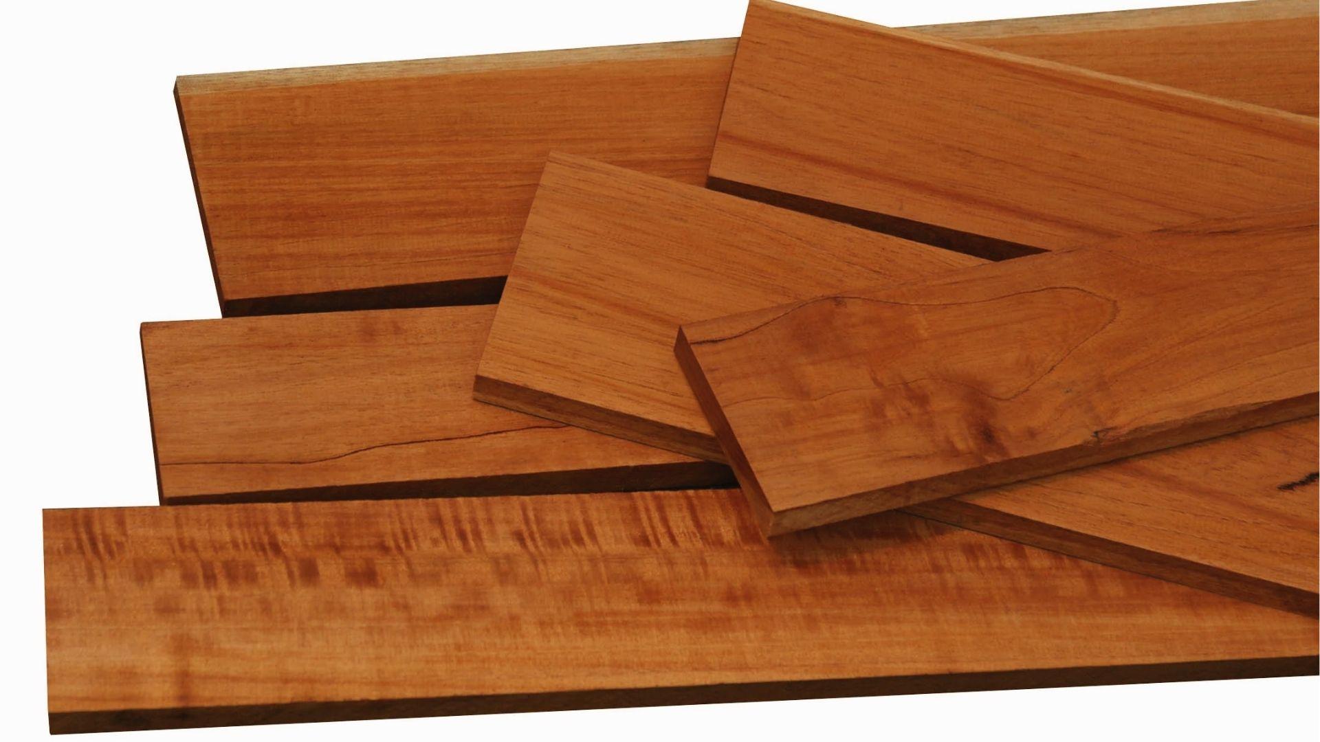 Stacked cedar hardwood logs, dense heavy wood ideal for luxury custom closet shelving.