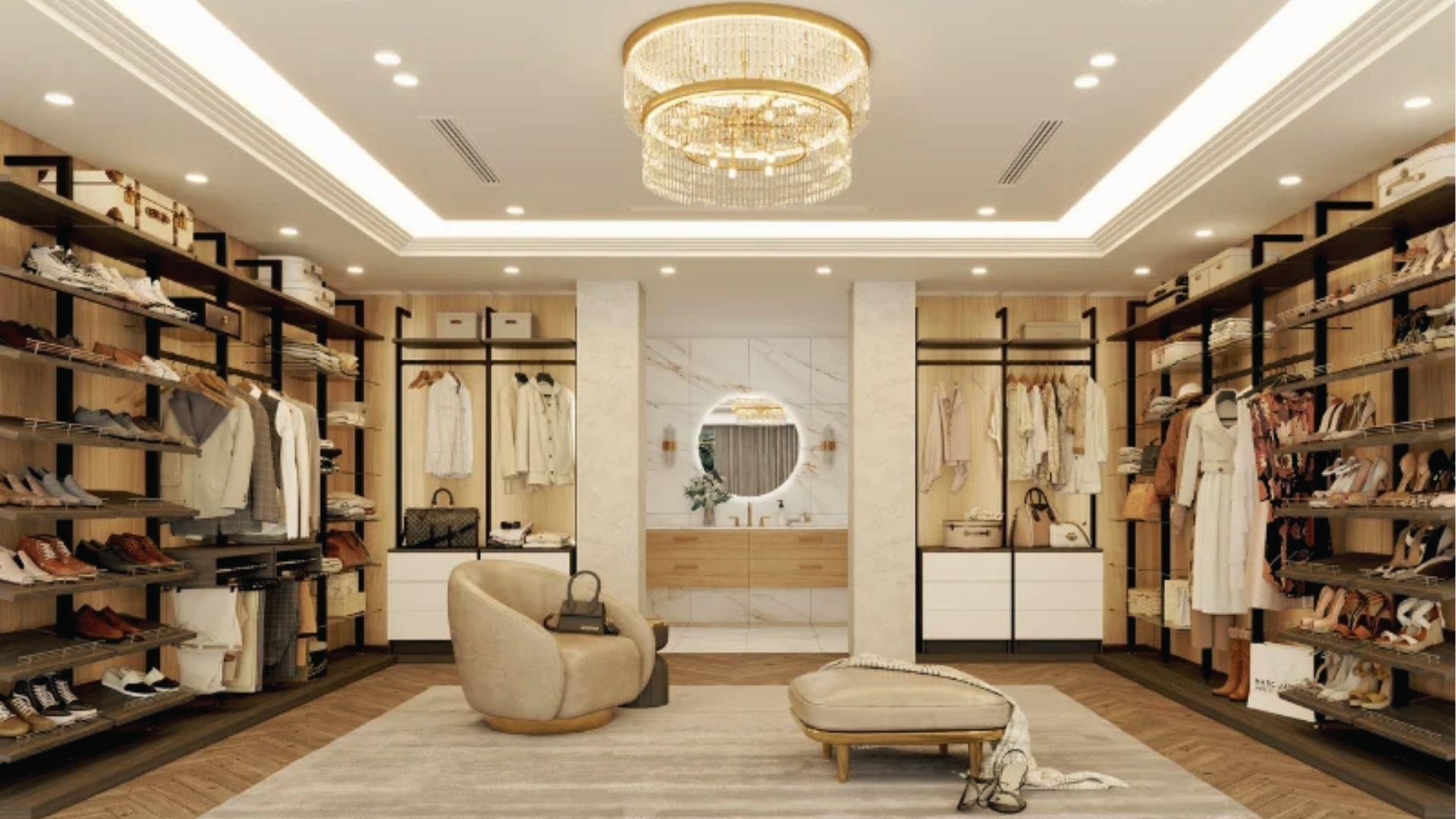 Luxury open-concept walk-in closet with chandelier, dual racks, and ensuite vanity view.