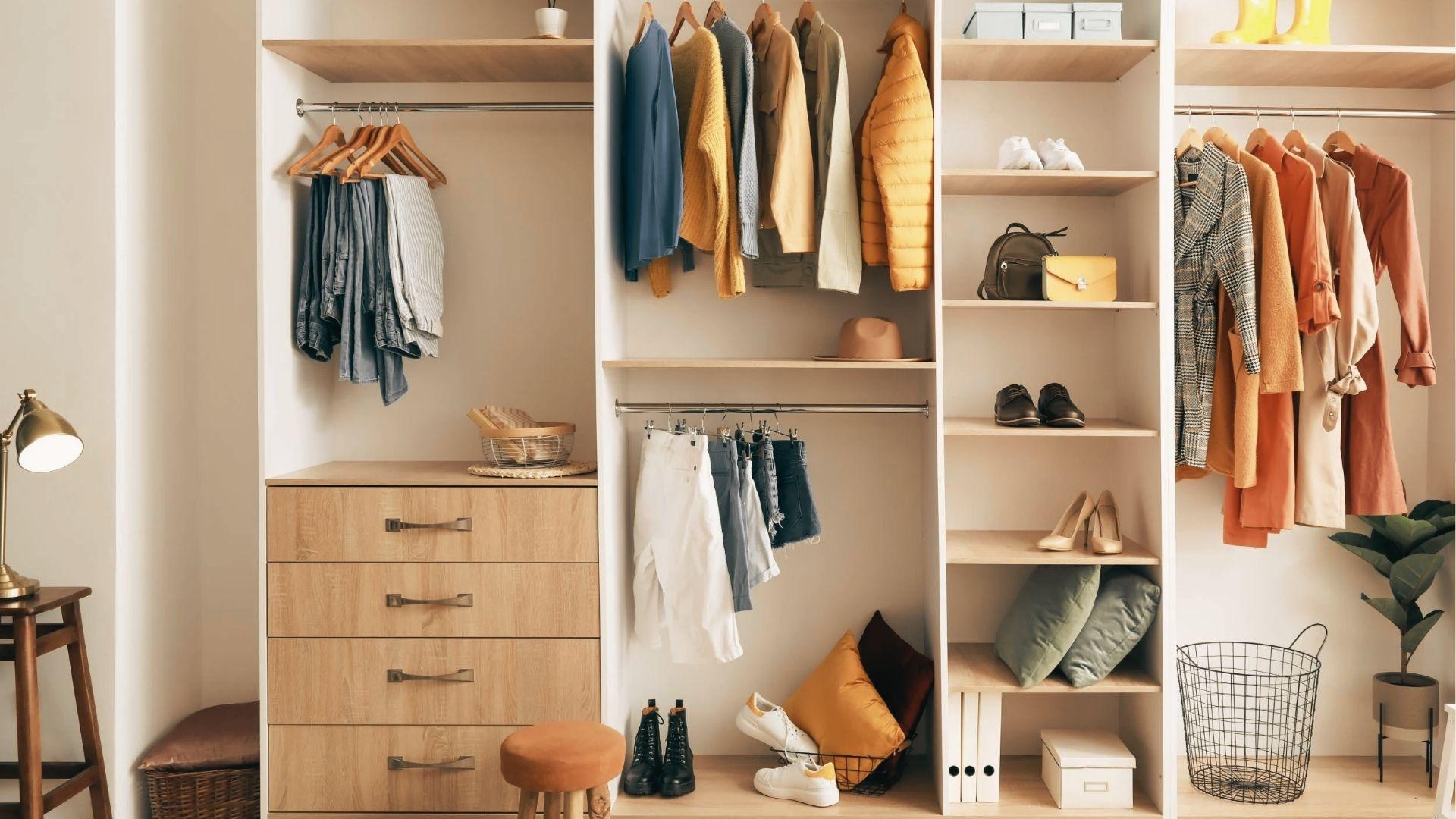 Light wood closet with mixed shelf heights: top shelf sits high for storage boxes.