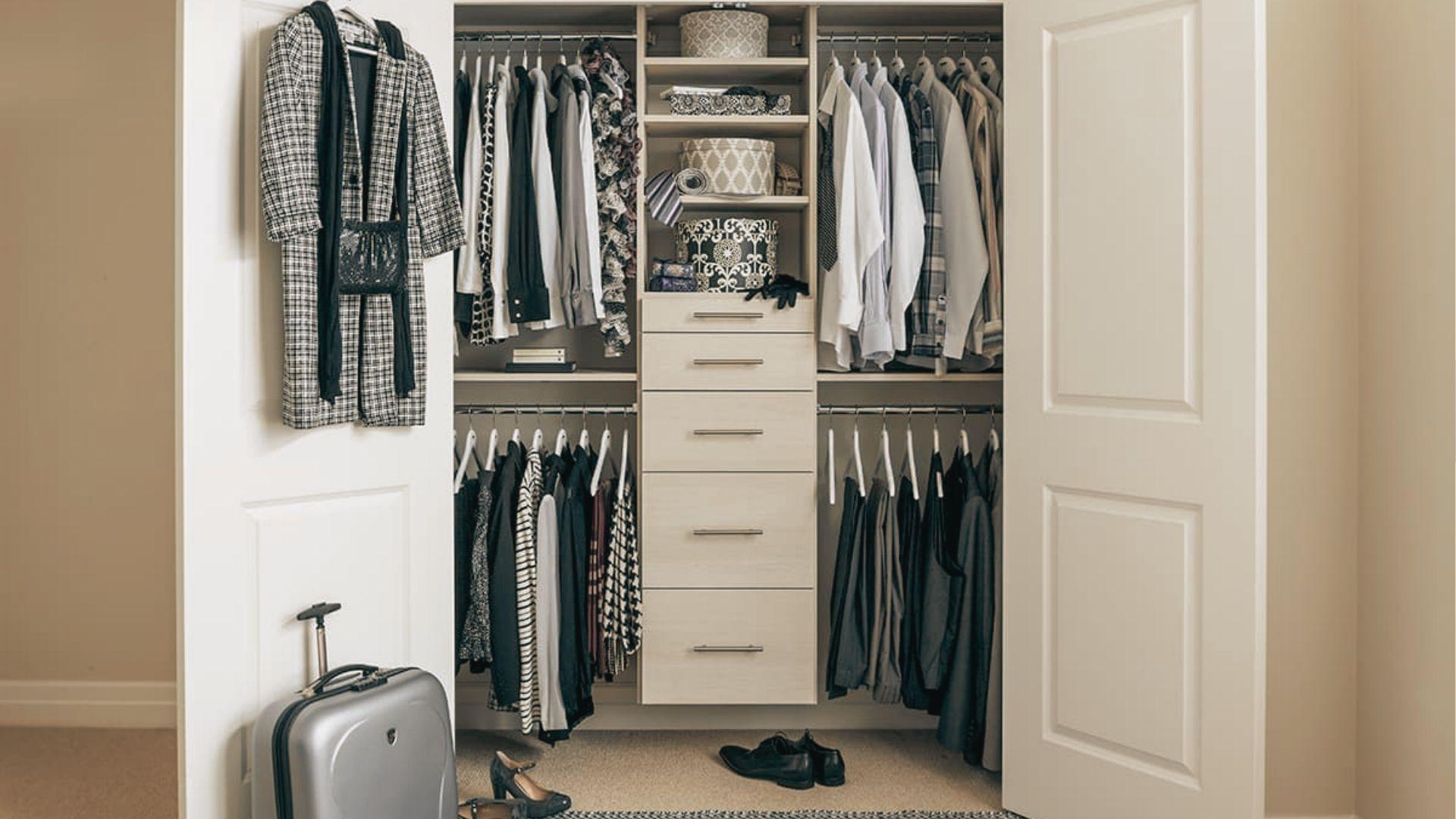 Sliding-door wardrobe with 14-inch deep interior shelves for folded linens and rolled clothes.