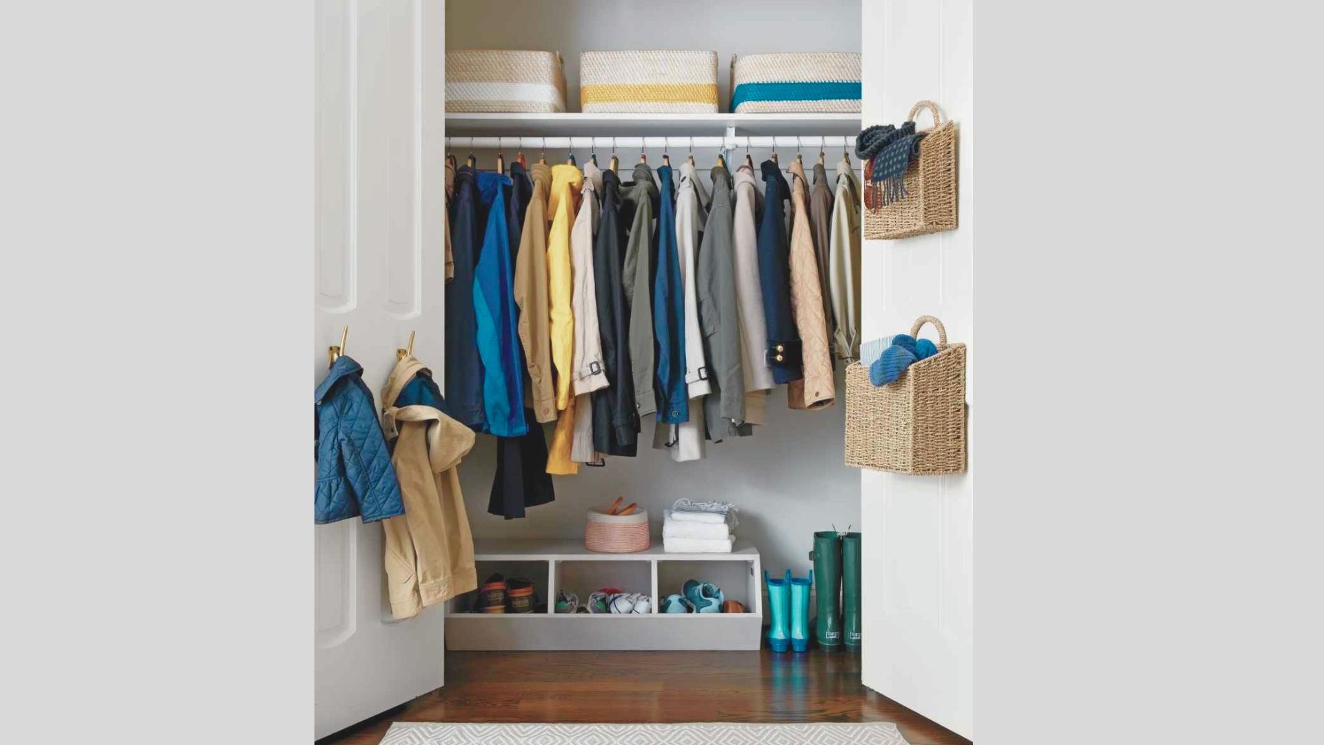 Single hanging rod mounted with a high shelf above for baskets, leaving 60+ inches of vertical space for coats and jackets.