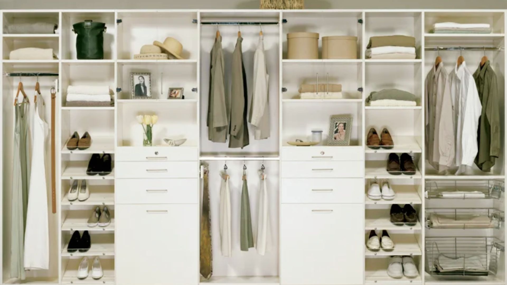 White reach-in closet with 12-inch deep shoe shelves and 24-inch deep hanging sections for folded clothes and bags.